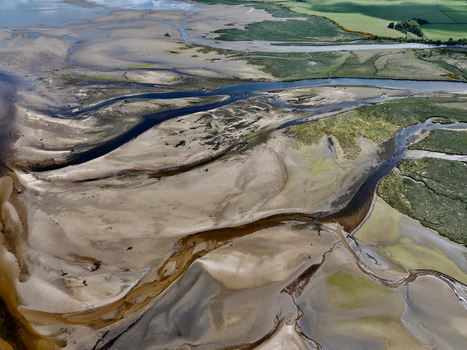 Aerial view of the intricate sandbanks and winding water channels of Findhorn Bay Findhorn Scotland United Kingdom. Aerial view of the intricate sandbanks and winding water channels of Findhorn Bay Findhorn Scotland United Kingdom.