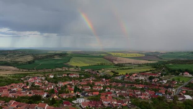 Aerial view of a double rainbow over Nasedlovice village Czechia.