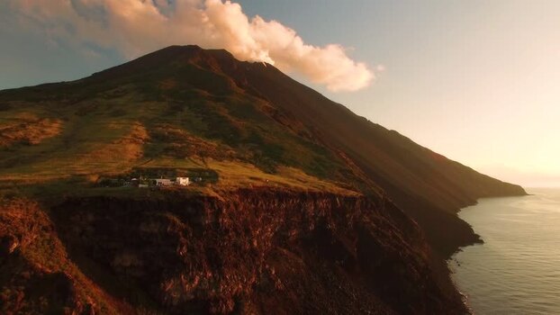 Aerial view of Stromboli volcano at sunset Italy.