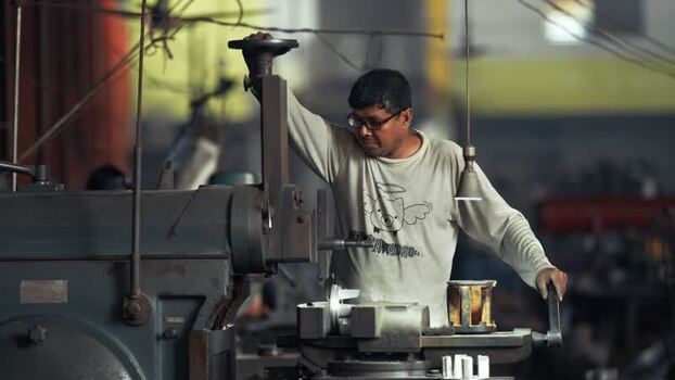 View of a worker operating industrial machinery in Bogura Bangladesh.