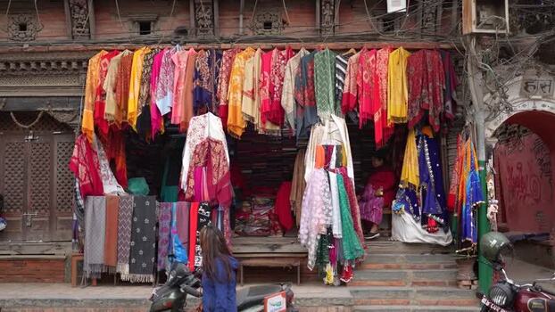 View of a traditional textile shop with colorful scarves Nepal. View of a traditional textile shop with colorful scarves Nepal.