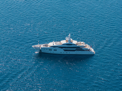 Aerial view of a luxury motor yacht cruising on the Mediterranean Sea Antibes Provence Alpes Cote d Azur France. Aerial view of a luxury motor yacht cruising on the Mediterranean Sea Antibes Provence Alpes Cote d Azur France.