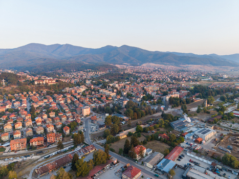 Aerial view of the town of Velingrad featuring residential houses a railway line and surrounding hills in Velingrad Pazardzhik Bulgaria. Aerial view of the town of Velingrad featuring residential houses a railway line and surrounding hills in Velingrad Pazardzhik Bulgaria.