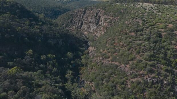 Aerial view of Onkaparinga Gorge with rocky cliffs and bushland Australia.