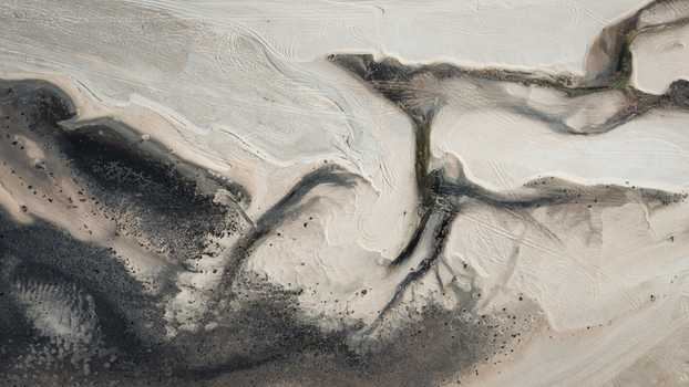 Aerial view of intricate sand patterns and tidal channels along the coastline in Denham Western Australia Australia. Aerial view of intricate sand patterns and tidal channels along the coastline in Denham Western Australia Australia.