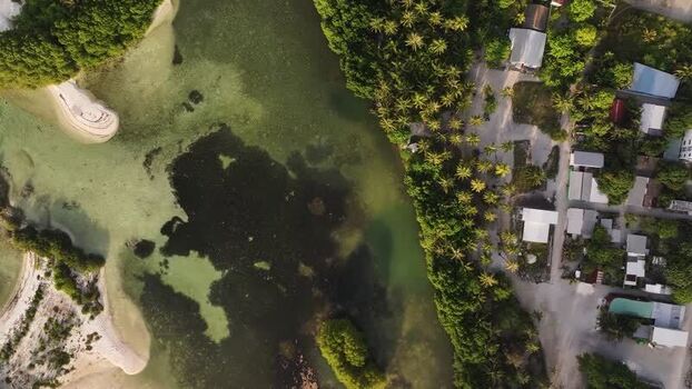 Aerial view of tropical island Goidhoo with palm trees and water Maldives. Aerial view of tropical island Goidhoo with palm trees and water Maldives.