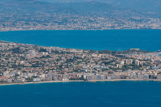 Aerial view of the coastal urban landscape of Antibes featuring sandy beaches dense buildings and the Mediterranean Sea in Antibes Provence Alpes Cote d Azur France. Aerial view of the coastal urban landscape of Antibes featuring sandy beaches dense buildings and the Mediterranean Sea in Antibes Provence Alpes Cote d Azur France.