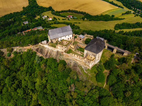 Aerial view of Tocnik Castle surrounded by dense forests and rolling agricultural fields in Tocnik Stredocesky kraj Czechia. Aerial view of Tocnik Castle surrounded by dense forests and rolling agricultural fields in Tocnik Stredocesky kraj Czechia.