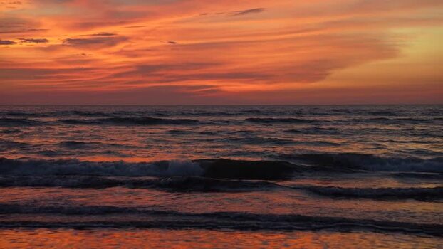 View of the sunset over the waves at Cox s Bazar beach Bangladesh. View of the sunset over the waves at Cox s Bazar beach Bangladesh.