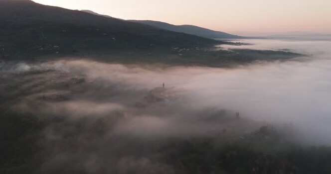Aerial view of the Balze del Valdarno landscape shrouded in morning fog Italy. Aerial view of the Balze del Valdarno landscape shrouded in morning fog Italy.