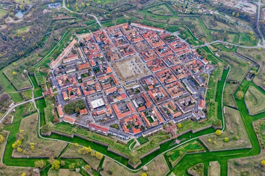 Aerial view of the star shaped fortress city with its symmetrical layout and red roofed buildings blending history and nature Neuf Brisach Grand Est France.