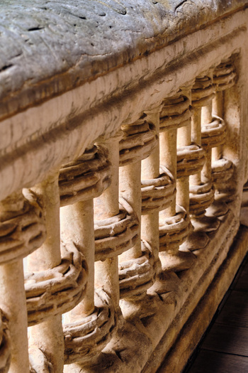 Salamanca Spain 29 November 2025 View of the intricate stone balustrade at the Casa de las Conchas showing detailed Gothic and Renaissance carvings and weathered textures.