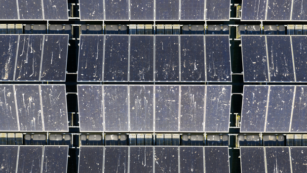 Aerial view of solar panels covered in bird droppings at a floating solar farm in Zwolle Overijssel Netherlands. Aerial view of solar panels covered in bird droppings at a floating solar farm in Zwolle Overijssel Netherlands.