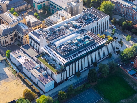 Aerial view of the modern Data Center at Oxford University featuring a green roof solar panels and contemporary architecture in Oxford England United Kingdom. Aerial view of the modern Data Center at Oxford University featuring a green roof solar panels and contemporary architecture in Oxford England United Kingdom.