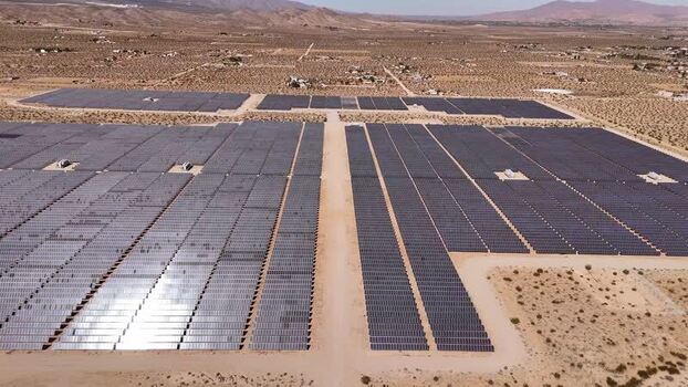 Aerial view of a large solar farm in the desert United States.