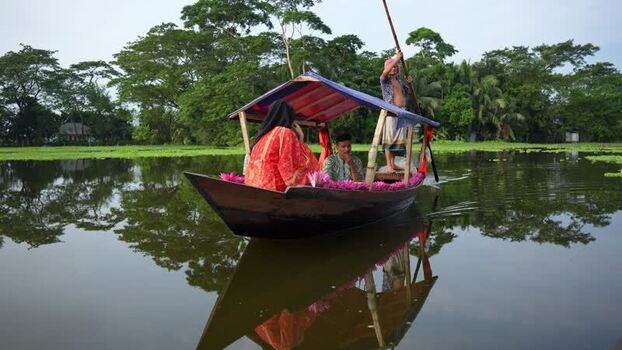 View of people on a traditional boat in Barishal Bangladesh. View of people on a traditional boat in Barishal Bangladesh.