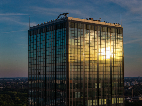 Aerial view of Berlin Treptowers with its glass facade reflecting the golden sunset in Berlin Berlin Germany. Aerial view of Berlin Treptowers with its glass facade reflecting the golden sunset in Berlin Berlin Germany.