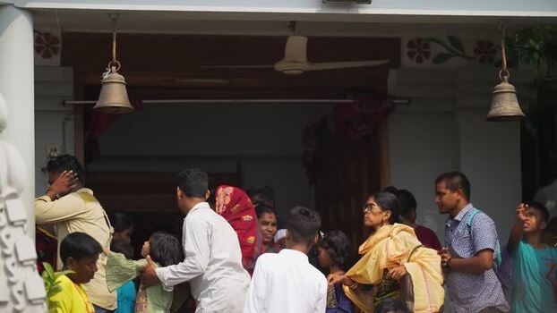 View of people at a temple entrance in Godagari Upazila Bangladesh. View of people at a temple entrance in Godagari Upazila Bangladesh.