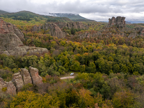 Aerial view of the Belogradchik Rocks surrounded by autumn forest and rocky terrain in Belogradchik Vidin Bulgaria. Aerial view of the Belogradchik Rocks surrounded by autumn forest and rocky terrain in Belogradchik Vidin Bulgaria.