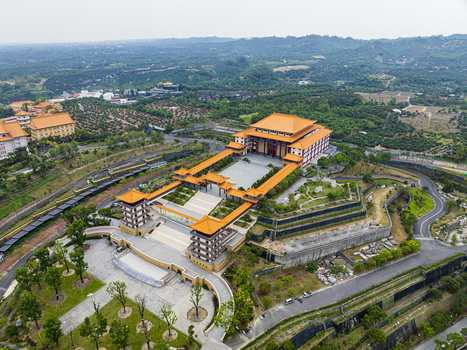 Aerial view of the Fo Guang Shan Buddha Museum with its traditional orange tiled roofs expansive courtyards and surrounding lush green hills in Jiuru Township Pingtung County Taiwan. Aerial view of the Fo Guang Shan Buddha Museum with its traditional orange tiled roofs expansive courtyards and surrounding lush green hills in Jiuru Township Pingtung County Taiwan.