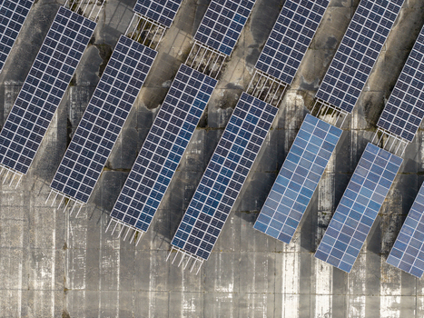 Aerial view of the solar field at the former military airfield in Preschen with rows of solar panels over the historic concrete runway and taxiway in Neisse Malxetal Brandenburg Germany. Aerial view of the solar field at the former military airfield in Preschen with rows of solar panels over the historic concrete runway and taxiway in Neisse Malxetal Brandenburg Germany.