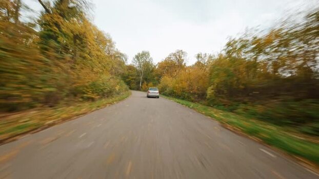 FPV aerial view of car on road in Fruska Gora SERBIA. FPV aerial view of car on road in Fruska Gora SERBIA.