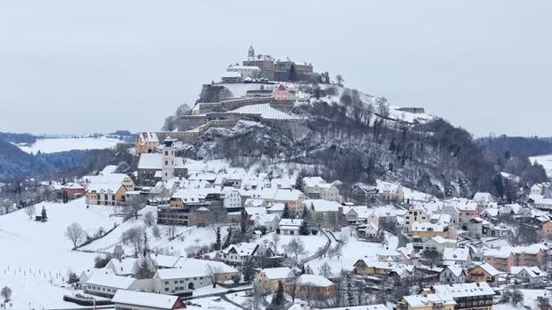 Aerial view of Riegersburg Castle and snow covered village Austria.