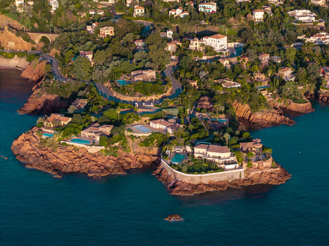 Aerial view of Le Trayas featuring luxury villas with swimming pools on rocky cliffs overlooking the Mediterranean Sea in Saint Raphael Provence Alpes Cote d Azur France. Aerial view of Le Trayas featuring luxury villas with swimming pools on rocky cliffs overlooking the Mediterranean Sea in Saint Raphael Provence Alpes Cote d Azur France.