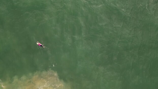 Aerial view of surfer at Praia da Mata Portugal. Aerial view of surfer at Praia da Mata Portugal.