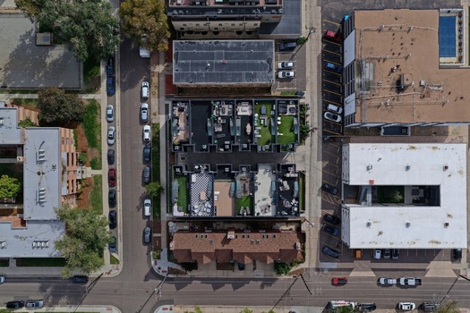 Aerial view of residential buildings with rooftop terraces and parking lots in the Cherry Creek neighborhood of Denver Colorado United States. Aerial view of residential buildings with rooftop terraces and parking lots in the Cherry Creek neighborhood of Denver Colorado United States.
