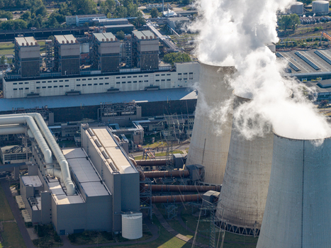 Aerial view of Janschwalde Power Station with large cooling towers emitting steam and industrial infrastructure in Peitz Brandenburg Germany. Aerial view of Janschwalde Power Station with large cooling towers emitting steam and industrial infrastructure in Peitz Brandenburg Germany.