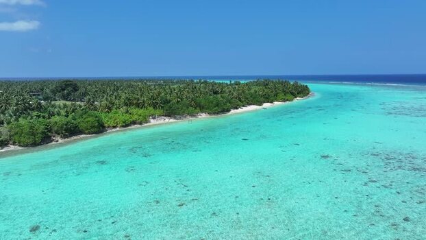 Aerial view of the tropical island with turquoise lagoon and palms Maldives. Aerial view of the tropical island with turquoise lagoon and palms Maldives.