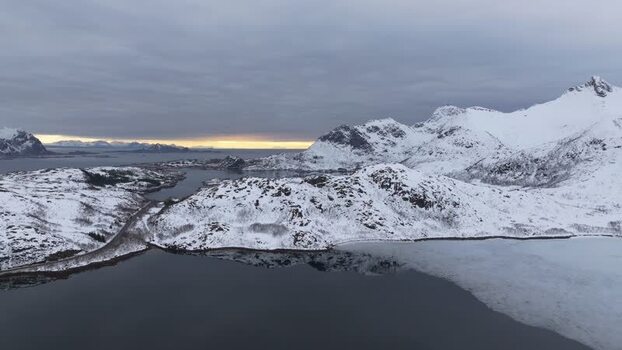 Aerial view of Lofoten mountains and snowy landscape Norway.