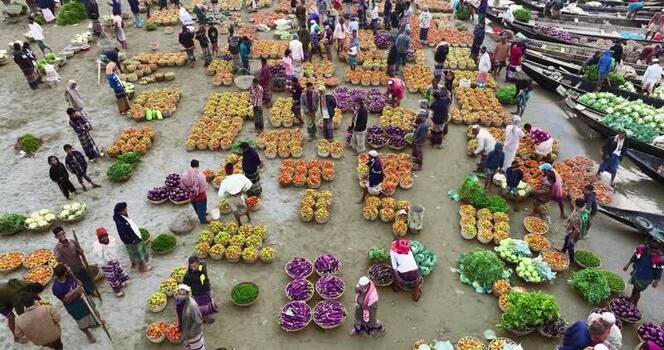 Aerial view of a bustling vegetable market in Sylhet Bangladesh. Aerial view of a bustling vegetable market in Sylhet Bangladesh.
