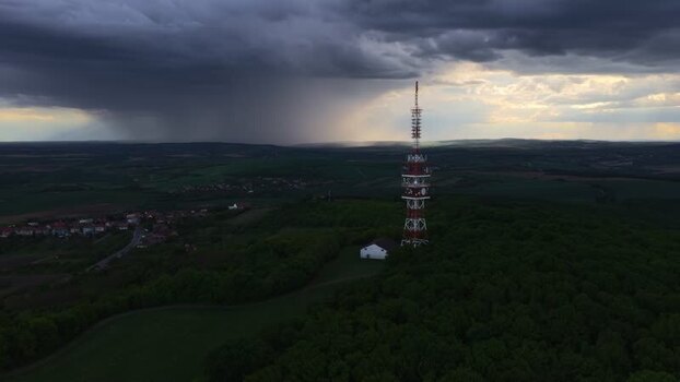 Aerial view of a transmitter tower under dark storm clouds Czechia. Aerial view of a transmitter tower under dark storm clouds Czechia.