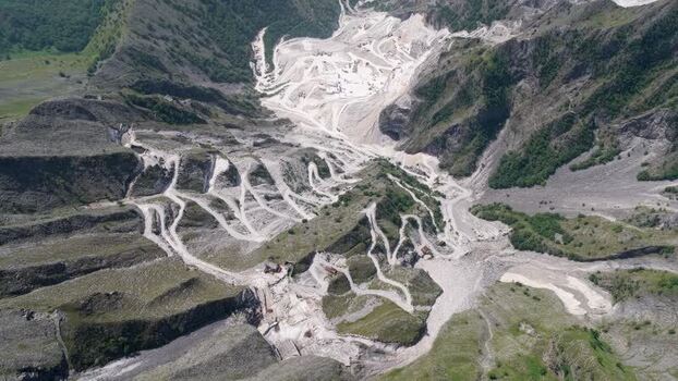 Aerial view of Carrara marble quarries in the mountains Italy. Aerial view of Carrara marble quarries in the mountains Italy.