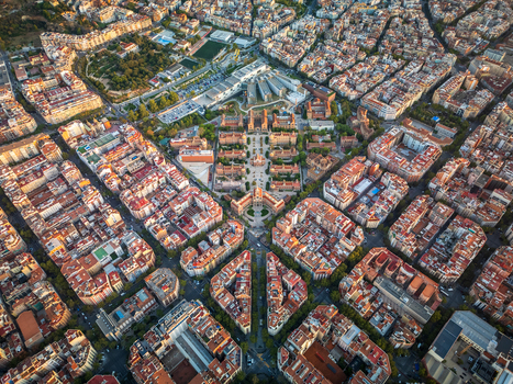 Aerial view of the historic Hospital de Sant Pau complex featuring its distinctive modernist architecture red tiled roofs and surrounding urban grid layout in Barcelona Catalonia Spain. Aerial view of the historic Hospital de Sant Pau complex featuring its distinctive modernist architecture red tiled roofs and surrounding urban grid layout in Barcelona Catalonia Spain.