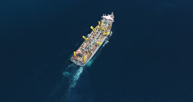 Aerial view of an industrial ship with yellow cranes Maldives. Aerial view of an industrial ship with yellow cranes Maldives.