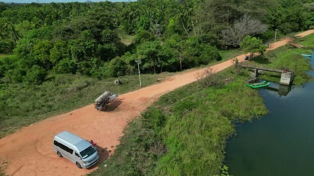 Aerial view of Sigiriya dirt road and lake Sri Lanka.