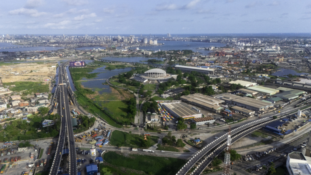 Aerial view of the Wole Soyinka Centre for Culture and Creative Arts National Theatre Nigeria surrounded by highways and urban landscape in Lagos Lagos Nigeria.