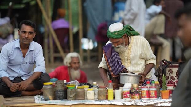 View of a traditional healer with jars at Mahasthan Bangladesh.