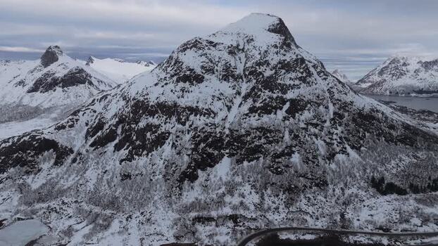 Aerial view of snow covered mountains in Lofoten Norway.