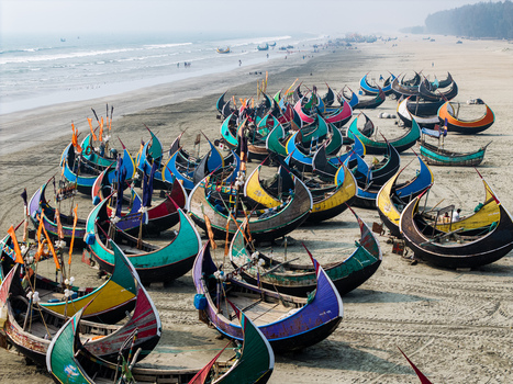 Cox s Bazar Bangladesh 10 March 2026 Aerial view of colorful traditional moon boats parked on the sandy shore of the world s longest natural sea beach. Cox s Bazar Bangladesh 10 March 2026 Aerial view of colorful traditional moon boats parked on the sandy shore of the world s longest natural sea beach.