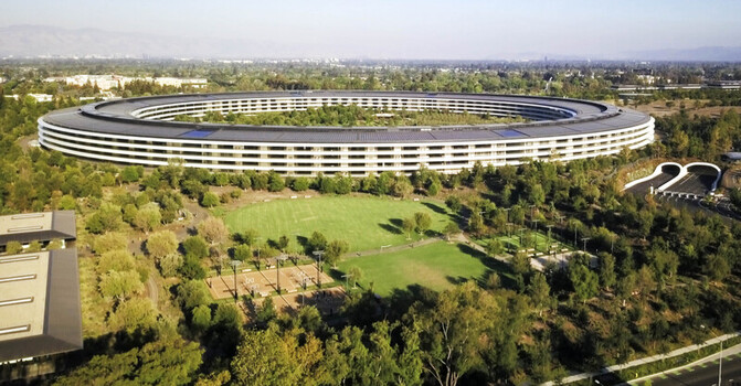 Cupertino CA United States 28 September 2026 Aerial view of Apple Park Headquarters the iconic ring shaped building surrounded by lush greenery trees and landscaped grounds.