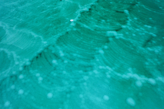 Aerial view of ethereal turquoise waters swirling with stark white salt formations revealing nature s abstract artistry Dead Sea Israel. Aerial view of ethereal turquoise waters swirling with stark white salt formations revealing nature s abstract artistry Dead Sea Israel.