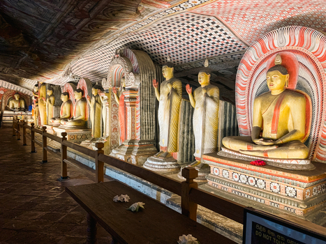Dambulla Sri Lanka 20 April 2024 View of the ancient Buddha statues inside the Dambulla Cave Temple featuring intricate wall paintings and ornate stone carvings.