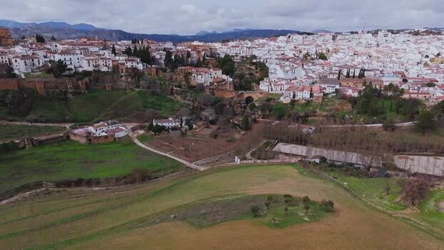 Aerial view of El Tajo Gorge and the walled city of Ronda Spain. Aerial view of El Tajo Gorge and the walled city of Ronda Spain.