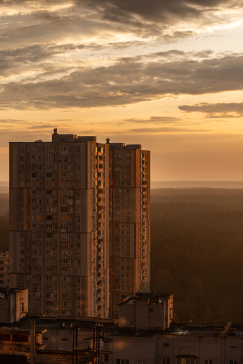 Aerial view of a monolithic building piercing the skyline under a sky ablaze with the warm hues of the setting sun Kyiv Kyiv city Ukraine. Aerial view of a monolithic building piercing the skyline under a sky ablaze with the warm hues of the setting sun Kyiv Kyiv city Ukraine.