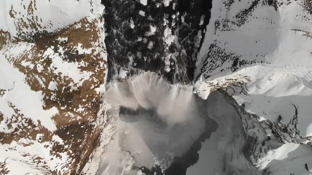 Aerial view of Skogafoss waterfall in winter Iceland.