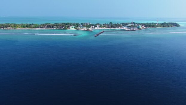 Aerial view of Vashafaru island with turquoise waters Maldives. Aerial view of Vashafaru island with turquoise waters Maldives.